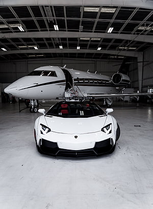 White Lamborghini Aventador and Private Jet in Hangar HD phone wallpaper