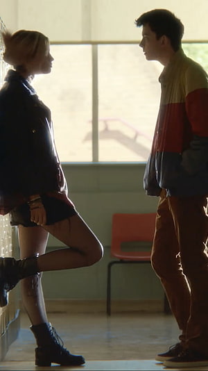 Maeve Wiley and Otis in a tense hallway confrontation from Sex Education HD phone wallpaper