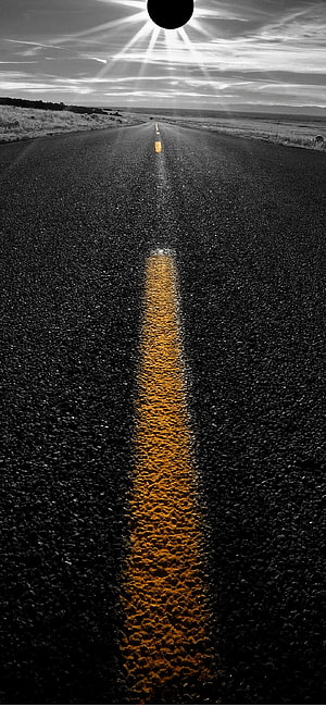 Black and White Road with Yellow Center Line and Sunburst HD phone wallpaper