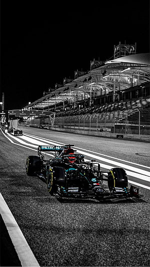 Mercedes Petronas Formula 1 Race Car on Night Circuit HD phone wallpaper