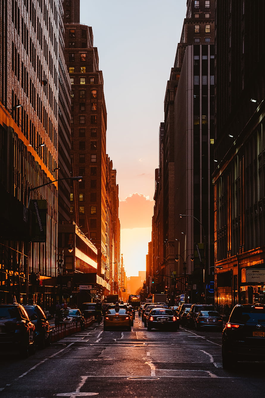 Golden Hour Sunset Over Busy New York City Street With Tall Skyscrapers And Traffic HD phone wallpaper