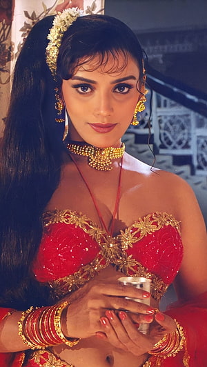 Madhuri Dixit in traditional red and gold bridal attire with heavy jewelry HD phone wallpaper
