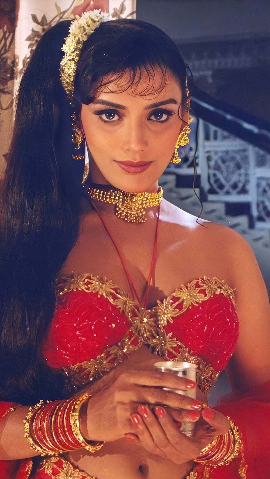 Madhuri Dixit in traditional red and gold bridal attire with heavy jewelry HD phone wallpaper