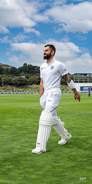 Virat Kohli Walking on Cricket Field in White Test Uniform HD phone wallpaper