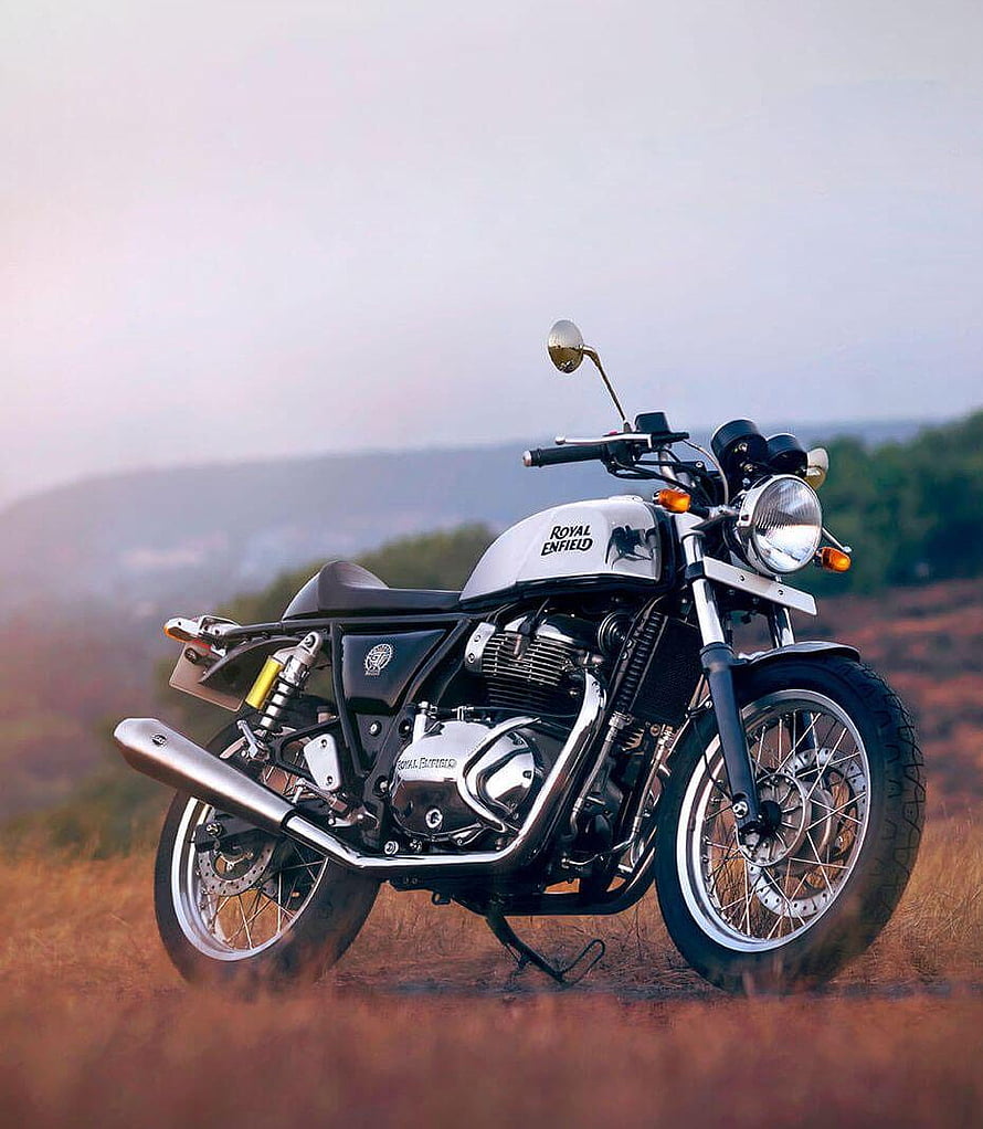 Royal Enfield Classic 350 motorcycle parked in a scenic field with mountains HD phone wallpaper