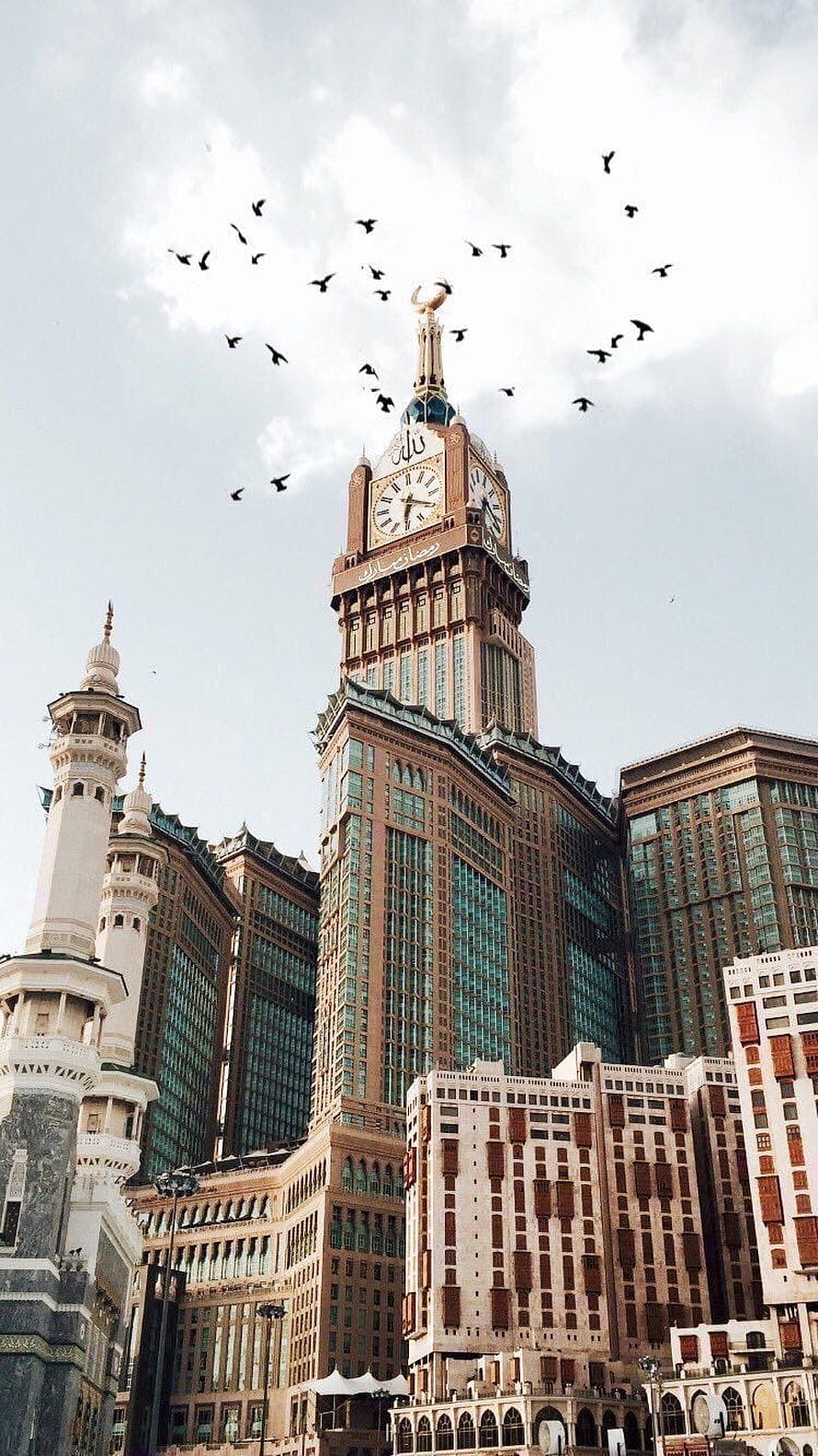 Abraj Al Bait Clock Tower in Mecca with flying birds against a cloudy sky HD phone wallpaper