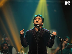 A R Rahman performing live on stage with dramatic concert lighting and a full band, A R Rahman . Movie soundtracks, Concert, Bollywood movie, A. R. Rahman HD wallpaper