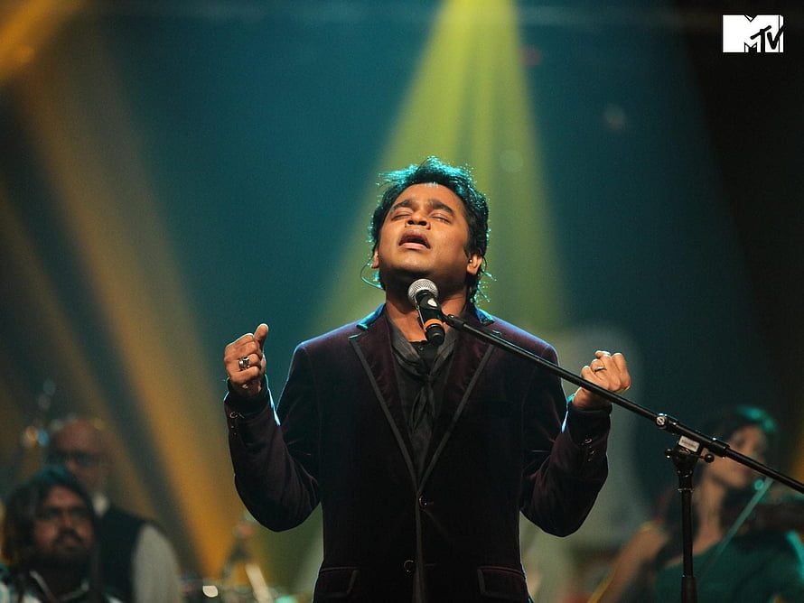A R Rahman performing live on stage with dramatic concert lighting and a full band, A R Rahman . Movie soundtracks, Concert, Bollywood movie, A. R. Rahman HD wallpaper