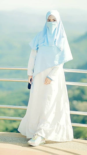 Elegant Muslim Woman in White Abaya and Light Blue Hijab Standing on a Scenic Balcony, Muslim Girl , White Gurkha HD phone wallpaper