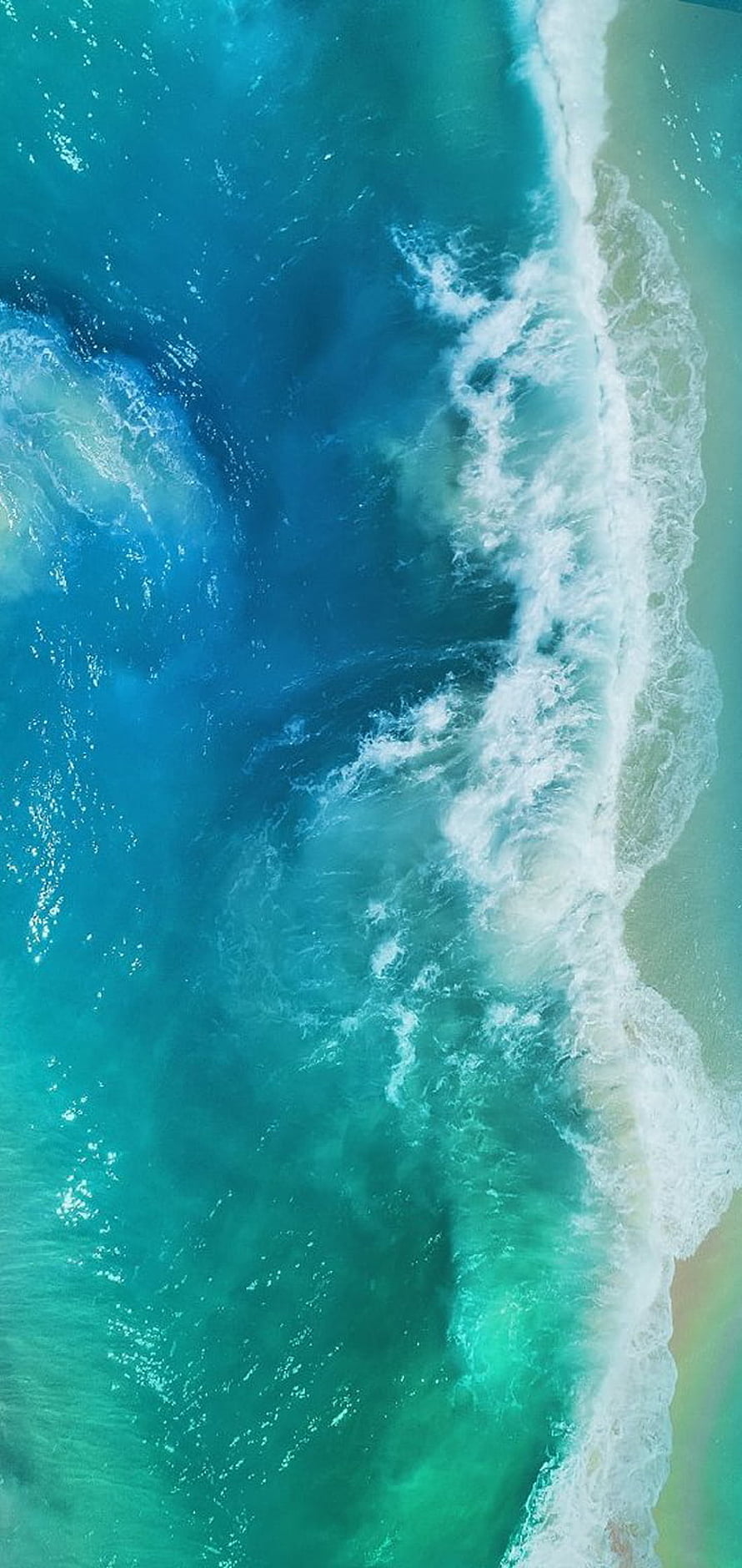 Aerial View of Turquoise Ocean Waves Rolling onto Sandy Shore HD phone wallpaper