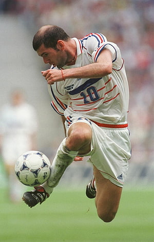 Zinedine Zidane in France 1998 World Cup Kit Dribbling the Ball on the Pitch HD phone wallpaper