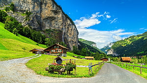 Alpine Chalet and Gravel Road in Lauterbrunnen Valley, Switzerland HD wallpaper