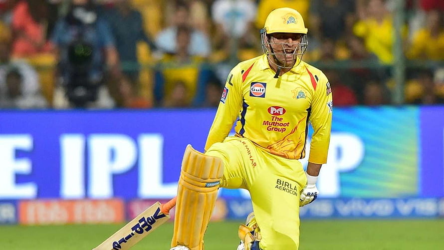 MS Dhoni in Chennai Super Kings yellow kit celebrating a wicket during an IPL cricket match HD wallpaper