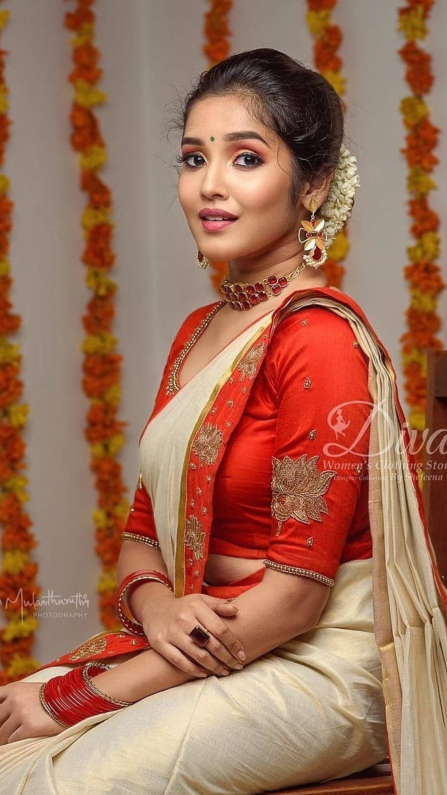 Anikha Surendran in Traditional Red and Cream Saree with Gold Jewelry HD phone wallpaper