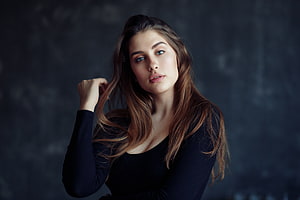 Portrait of a beautiful woman with long brown hair and blue eyes wearing a black top against a dark background, Hot and brunette, girl model, beautiful HD wallpaper