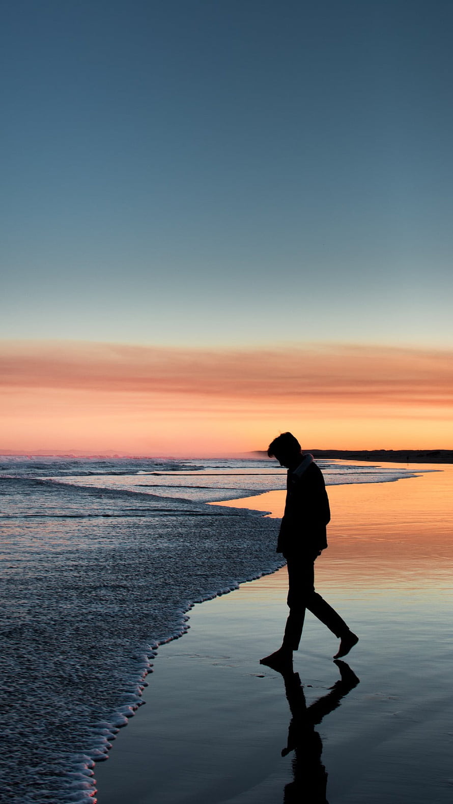Silhouette of a man walking along the wet sand at sunset with ocean waves and colorful sky, Alone, Broken Heart Boy HD phone wallpaper