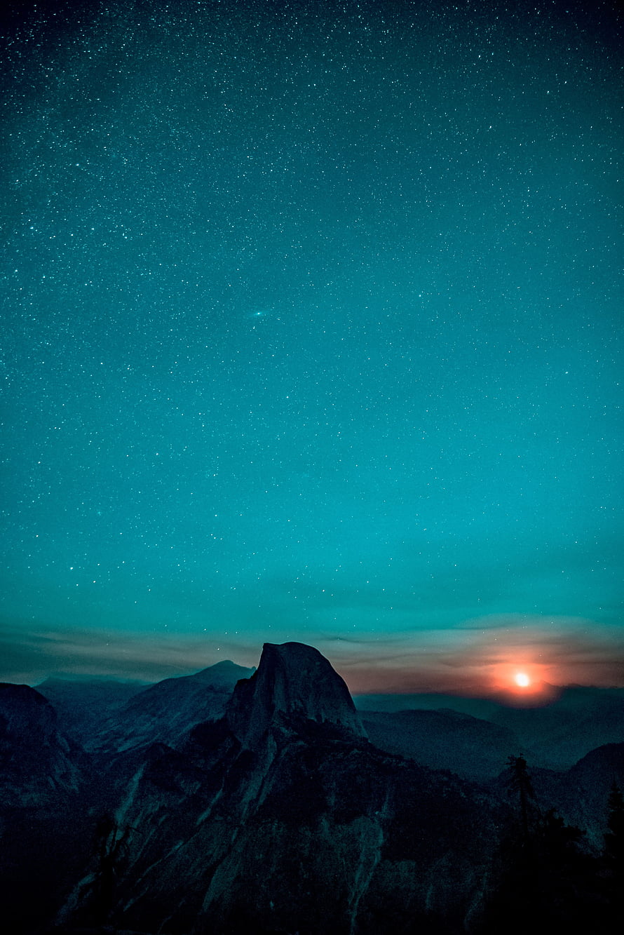 Yosemite Valley at Dawn with a Star-Filled Teal Sky and a Glowing Sunrise Over the Peaks HD phone wallpaper