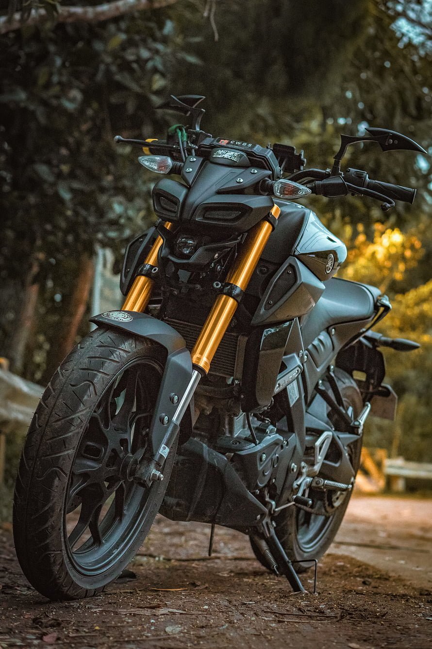 Matte Black Yamaha MT-09 Motorcycle with Gold Forks in Forest HD phone wallpaper
