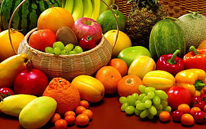 Vibrant Assorted Fresh Fruit Arrangement in Wicker Basket with Melons and Grapes HD wallpaper