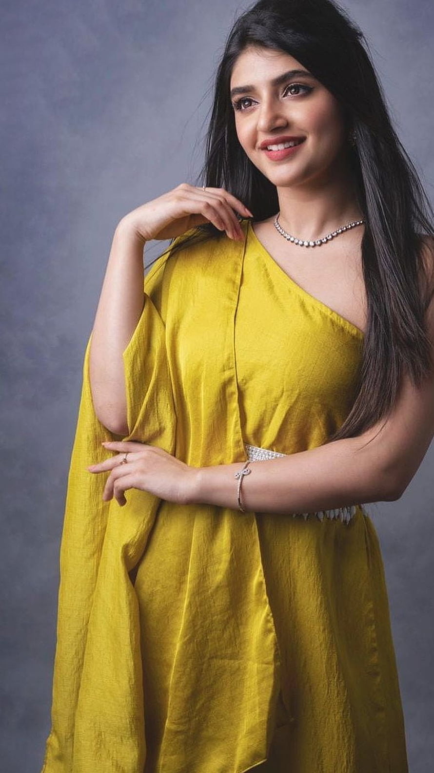 Sreeleela in a mustard yellow one-shoulder gown with diamond jewelry HD phone wallpaper