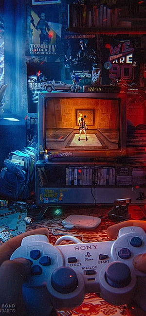 Retro Gaming Setup with PlayStation Controller and Tomb Raider on CRT TV HD phone wallpaper