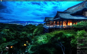 Traditional Japanese Pavilion on a Hillside at Dusk with City Lights in the Distance HD wallpaper