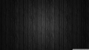 Dark Charcoal Wood Plank Texture with Vertical Grain Pattern HD wallpaper