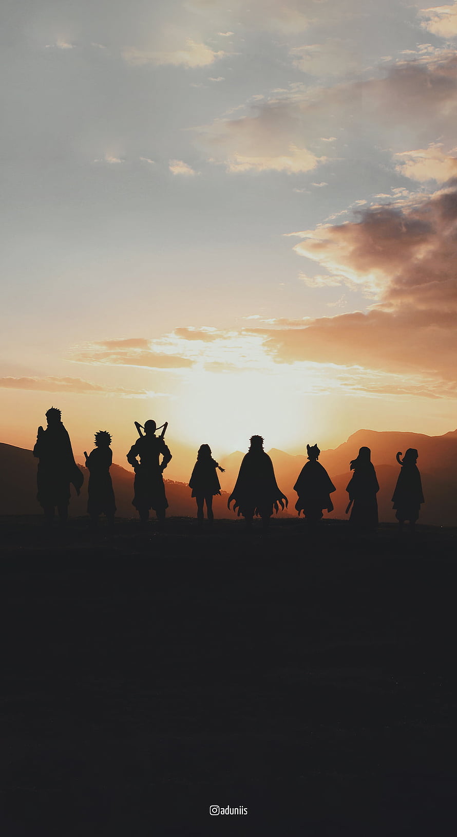 Demon Slayer Hashira silhouettes standing against a golden sunset sky with mountains HD phone wallpaper