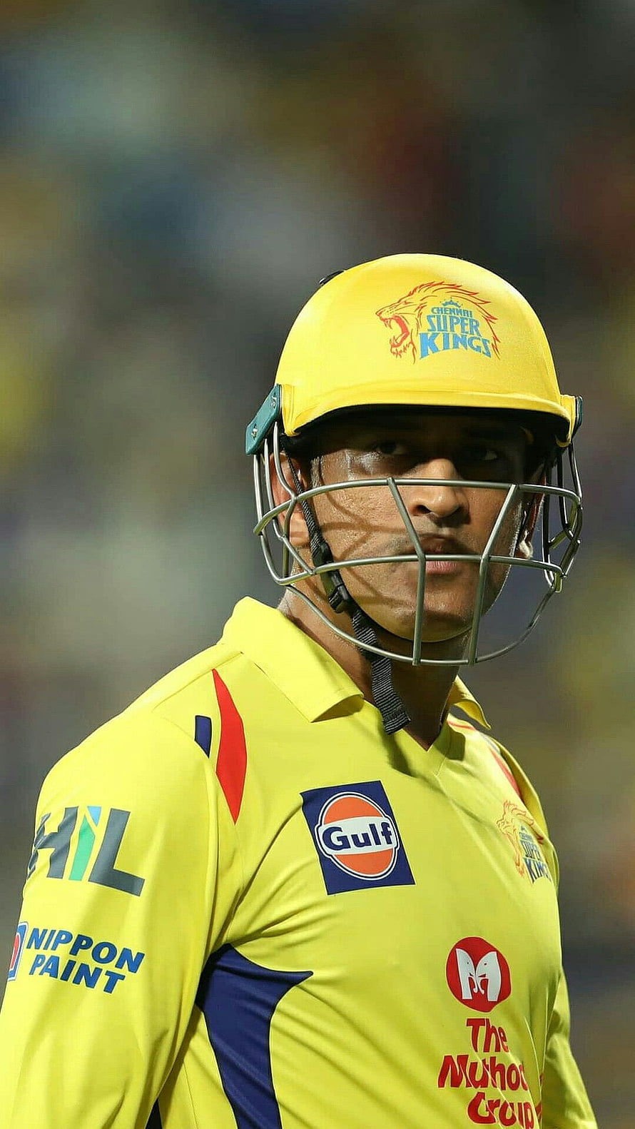 MS Dhoni in Chennai Super Kings yellow cricket kit with helmet and sponsor logos HD phone wallpaper