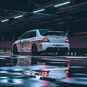 White Mitsubishi Lancer Evolution IX parked in a wet underground garage with dramatic reflections HD phone wallpaper