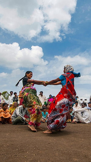 Two Women Performing Traditional Fugadi Dance at a Varkari Festival Gathering HD phone wallpaper