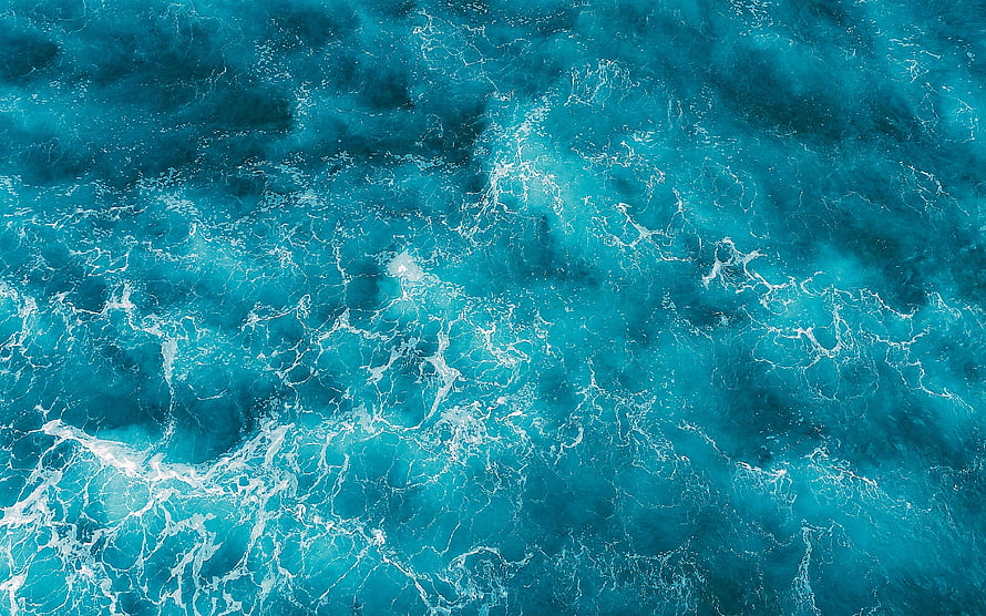 Aerial View of Turquoise Ocean Waves with White Sea Foam and Deep Blue Water Texture HD wallpaper