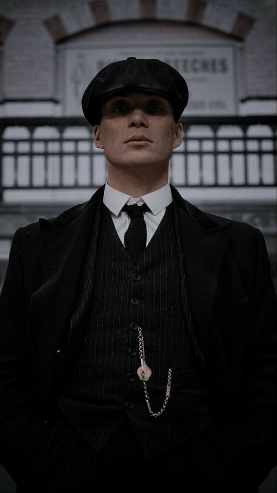 Tommy Shelby from Peaky Blinders in black suit and flat cap HD phone wallpaper