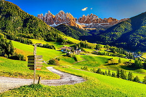 Dolomites Mountain Range with Green Alpine Meadows and Village in Italy HD wallpaper