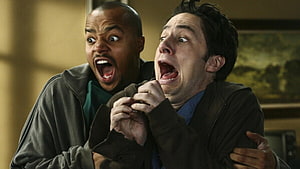 Two Men Screaming in Panic During a Chaotic Physical Comedy Scene HD wallpaper