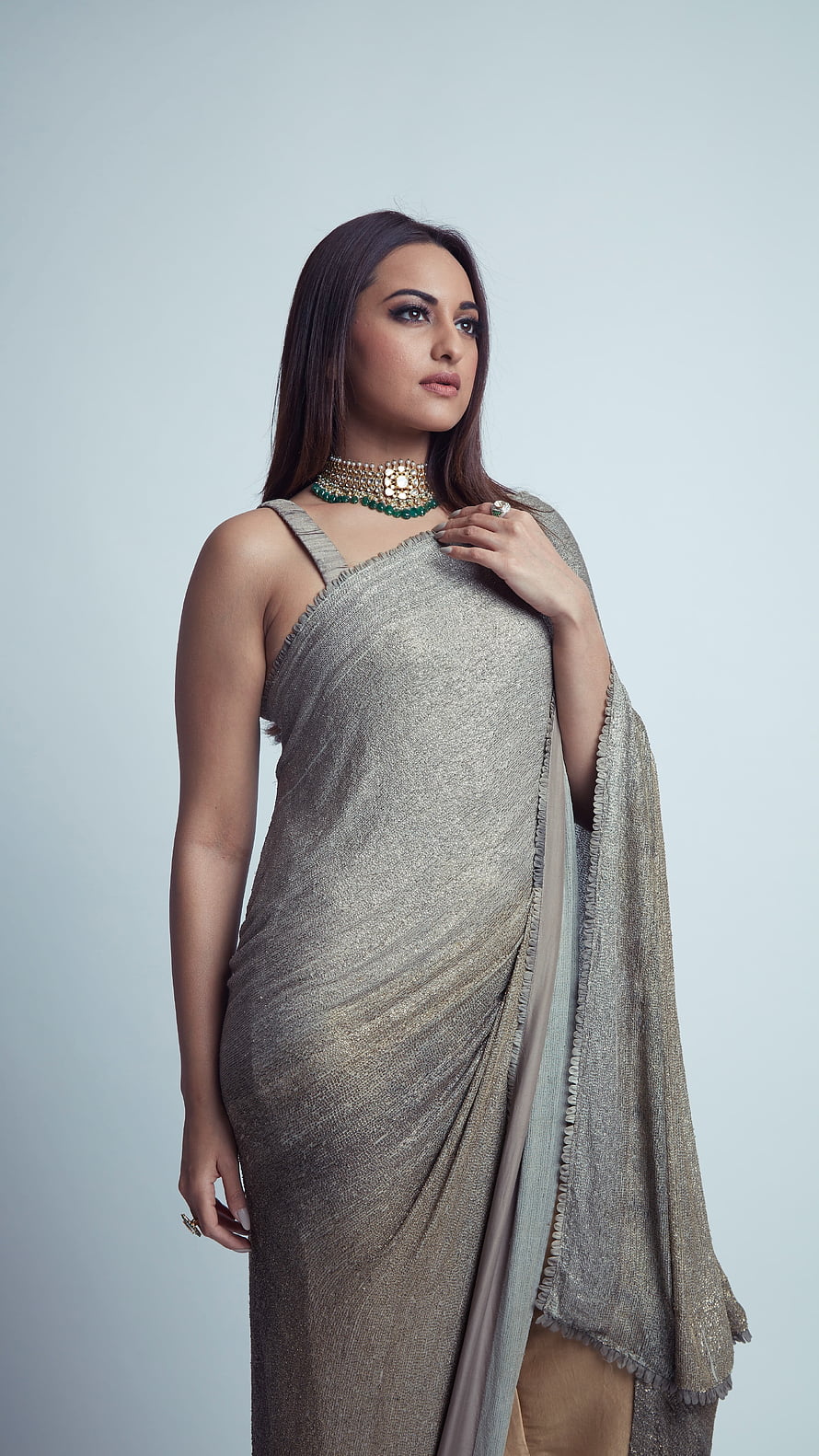 Sonakshi Sinha in a shimmering silver saree with traditional gold and emerald jewelry HD phone wallpaper