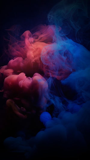 Vibrant red and blue smoke swirling against a dark background HD phone wallpaper
