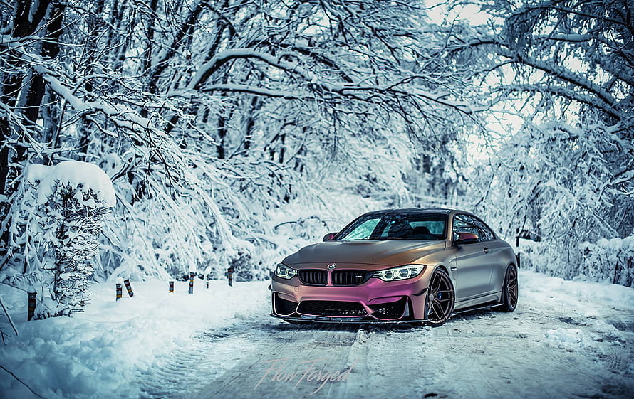 BMW M4 Coupe with Custom Pink Wrap Parked on a Snowy Forest Road HD wallpaper