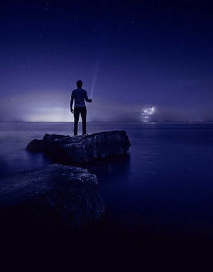 Man Standing on Rock Under Starry Night Sky with Flashlight Beam, Feeling Sad ( Boys & Girls) Whatsapp DP HD phone wallpaper
