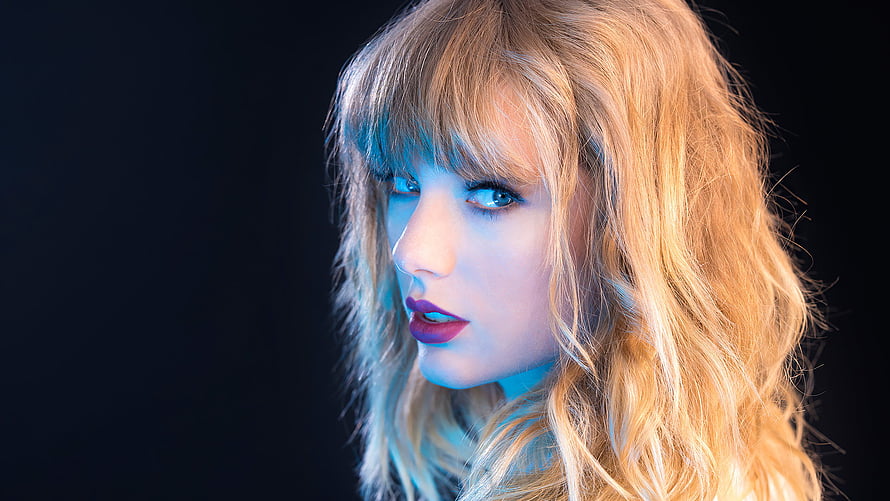 Taylor Swift Portrait with Blue Neon Lighting and Dark Background HD wallpaper