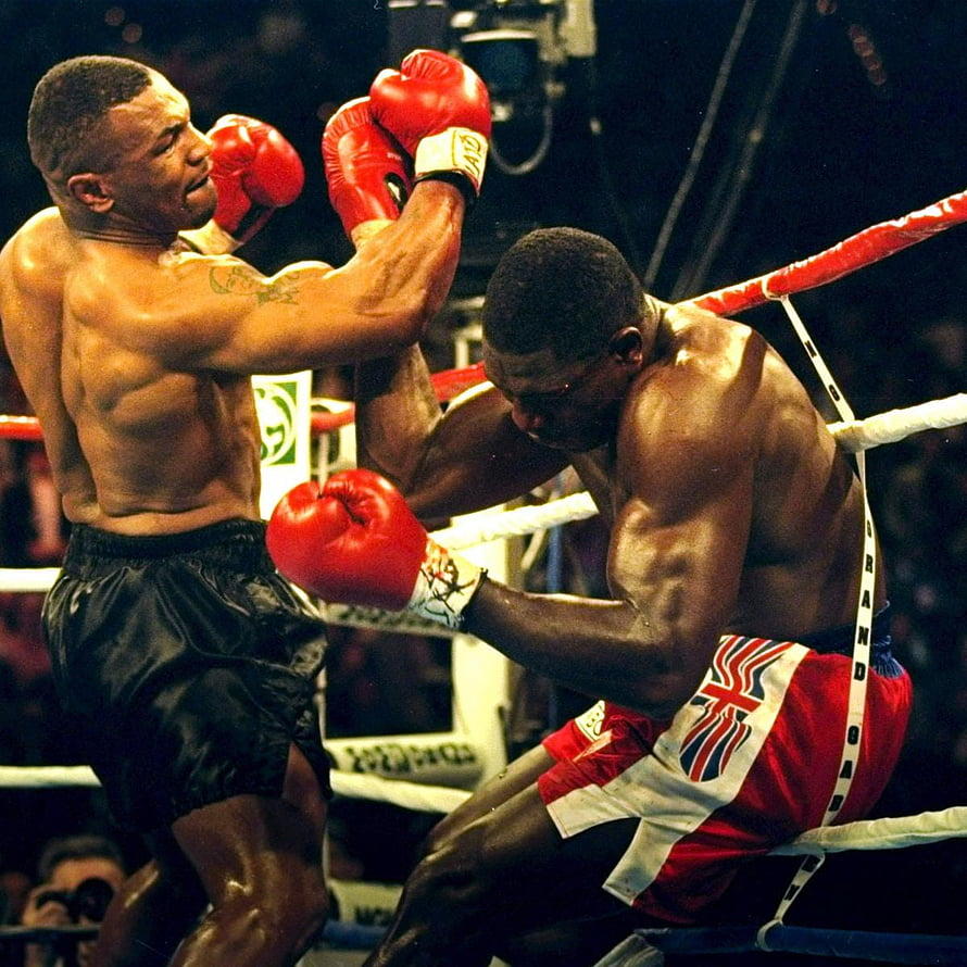Mike Tyson Delivers a Powerful Uppercut in a Classic Boxing Match HD phone wallpaper