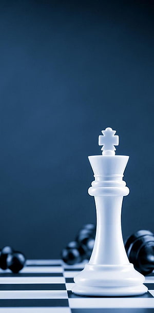 White Chess King Piece Standing on a Blue Tinted Checkered Board HD phone wallpaper