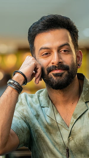 Prithviraj Sukumaran Portrait in Sage Green Shirt with Leather Bracelets HD phone wallpaper