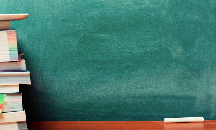 Classroom Chalkboard with Stacked Books and Chalk on Wooden Desk HD wallpaper