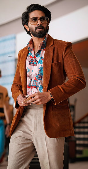 Dulquer Salmaan stylish look in brown corduroy blazer and patterned shirt HD phone wallpaper