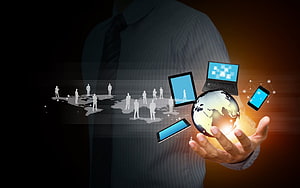 Businessman Holding Digital Globe With Laptops And Smartphones, Information Technology Network Hand Business HD wallpaper