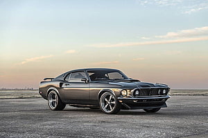Classic Black Ford Mustang Mach 1 on Asphalt at Sunset HD wallpaper