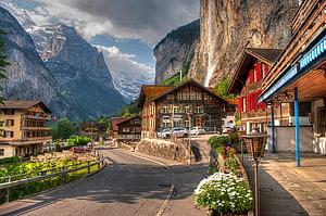 Lauterbrunnen Village in the Swiss Alps with Traditional Chalets and Waterfall HD wallpaper