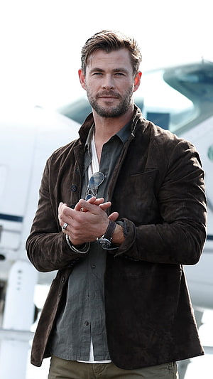 Chris Hemsworth in Brown Suede Jacket and Grey Shirt with Watch and Sunglasses HD phone wallpaper