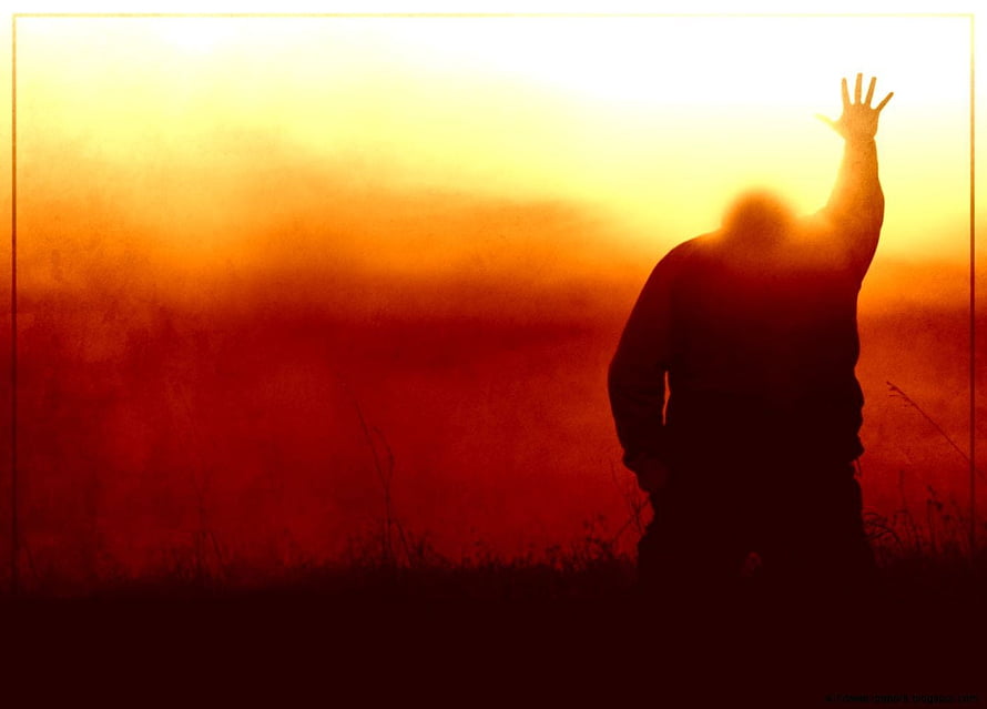 Silhouette of a person reaching toward a glowing sunrise in a misty field HD wallpaper